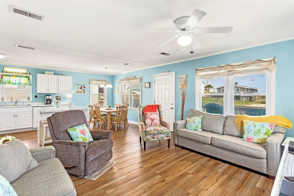 Living Room: Comfortable seating and coastal décor create the perfect spot to relax and reconnect.