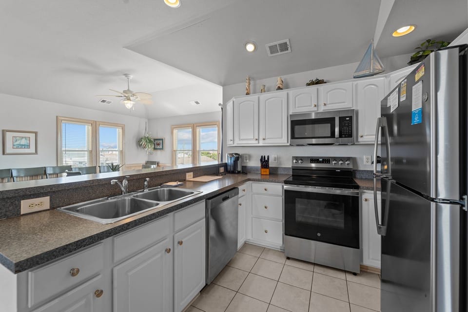 Cook up something amazing in the spacious Kitchen with modern appliances.