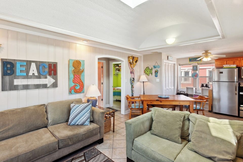 Enjoy bright windows and comfy relaxation around the Flat Screen TV in the Living Area with a Queen Sleeper Sofa.