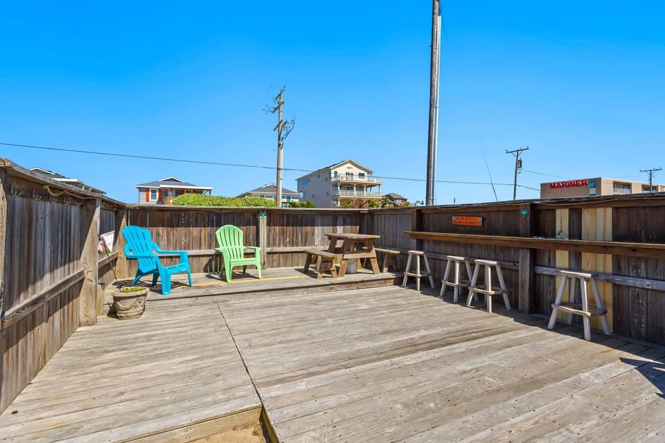 Enjoy the ultimate outdoor vacation experience on the spacious Patio with a convenient Outdoor Bar and cozy chairs as well as a Charcoal Grill.