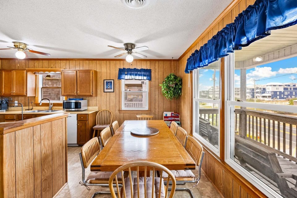 The dining area offers seating for eight, making it perfect for family meals and game nights.