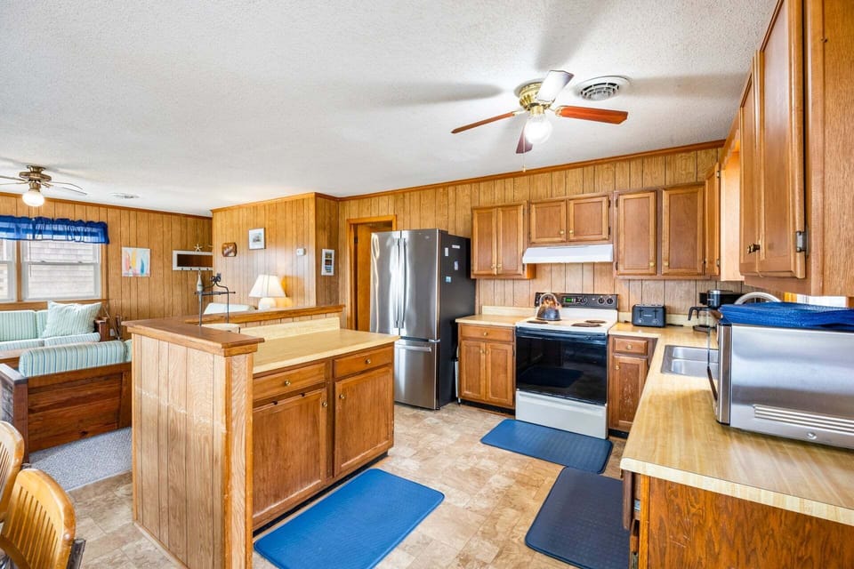 The fully stocked kitchen provides ample counter space and everything needed to prepare vacation meals.