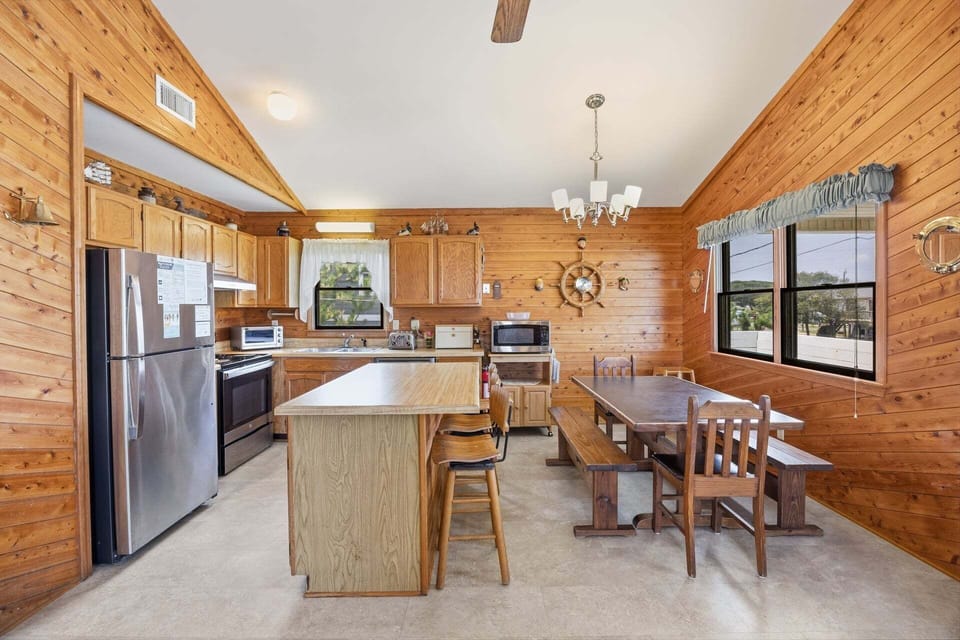 Cook fresh local seafood while staying connected to family in the adjoining living and dining areas.
