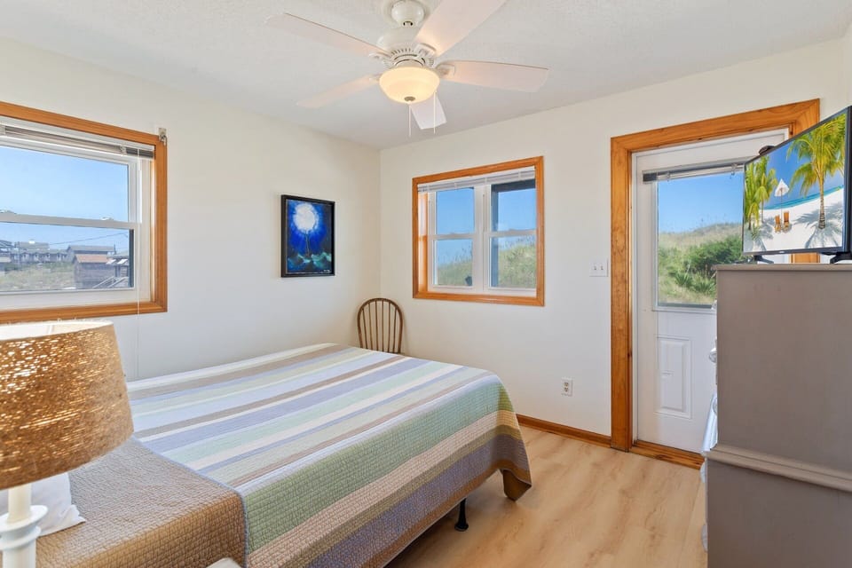 This inviting Queen Bedroom offers a peaceful retreat with easy access to nearby bathrooms and living spaces.