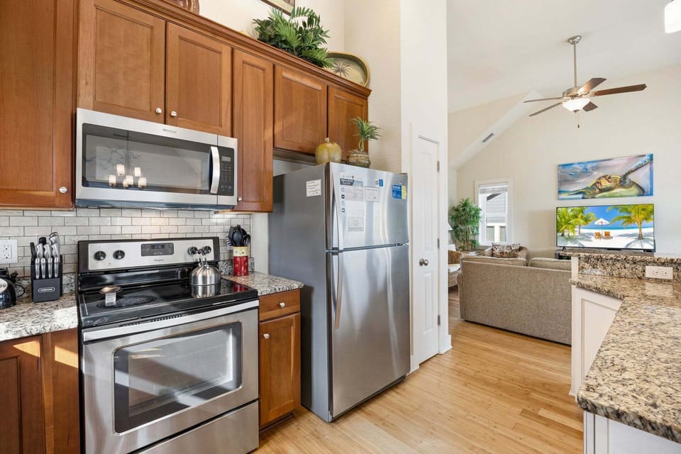 The fully equipped kitchen features modern appliances and everything you need for vacation meals.