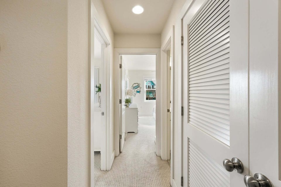 A bright passage connecting upstairs bedrooms, designed for easy flow and a sense of spaciousness.