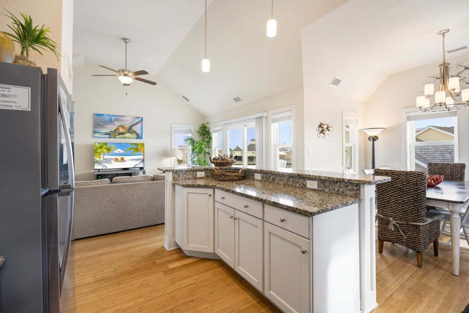 The fully equipped kitchen features modern appliances and everything you need for vacation meals.