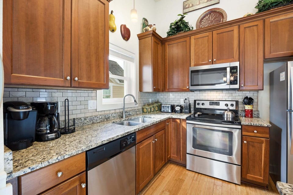 The fully equipped kitchen features modern appliances and everything you need for vacation meals.