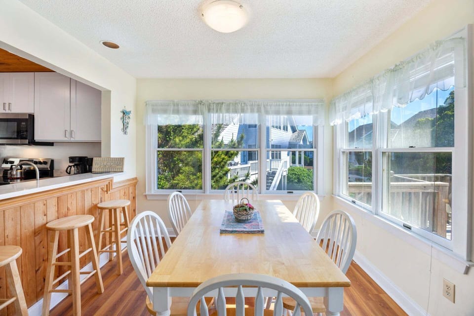 A kitchen bar, breakfast nook, and formal dining area offer plenty of seating options.