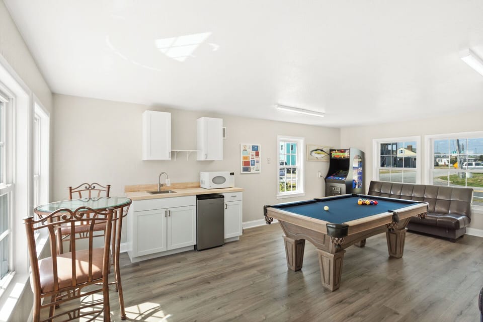 Enjoy a game of Pool in the Pool House with a Wet Bar and extra refrigerator!