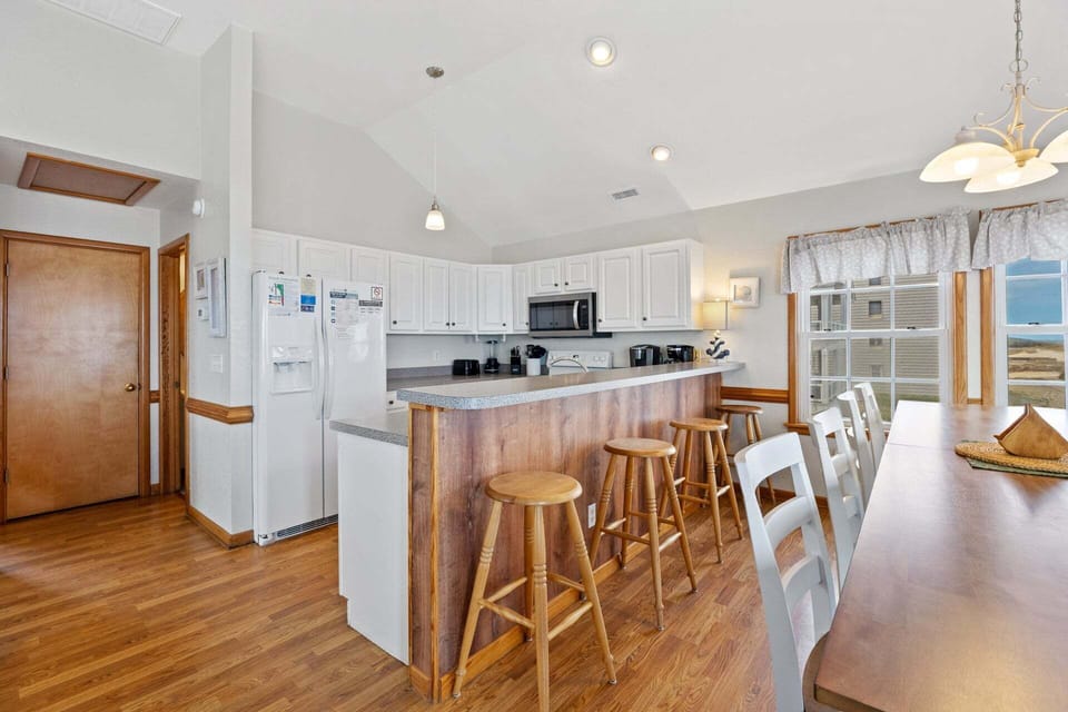 Whip up a fantastic meal in the Kitchen with all modern amenities, double sinks, and a Breakfast Bar that seats 3.
