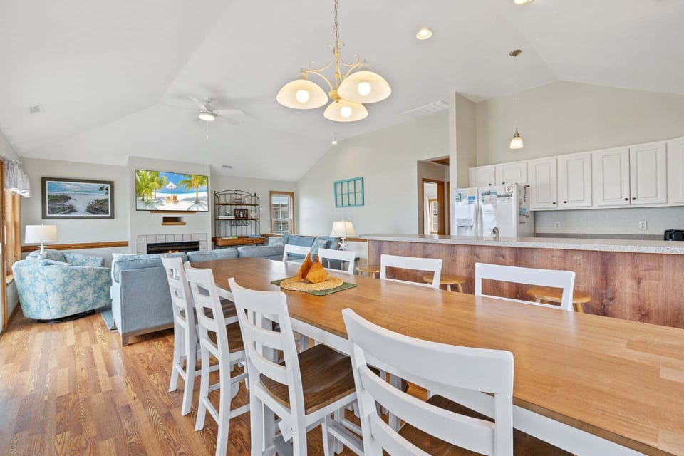 Enjoy your meal together in the Dining Area with seating for 8 before relaxing out on the Screened-In Porch nearby.