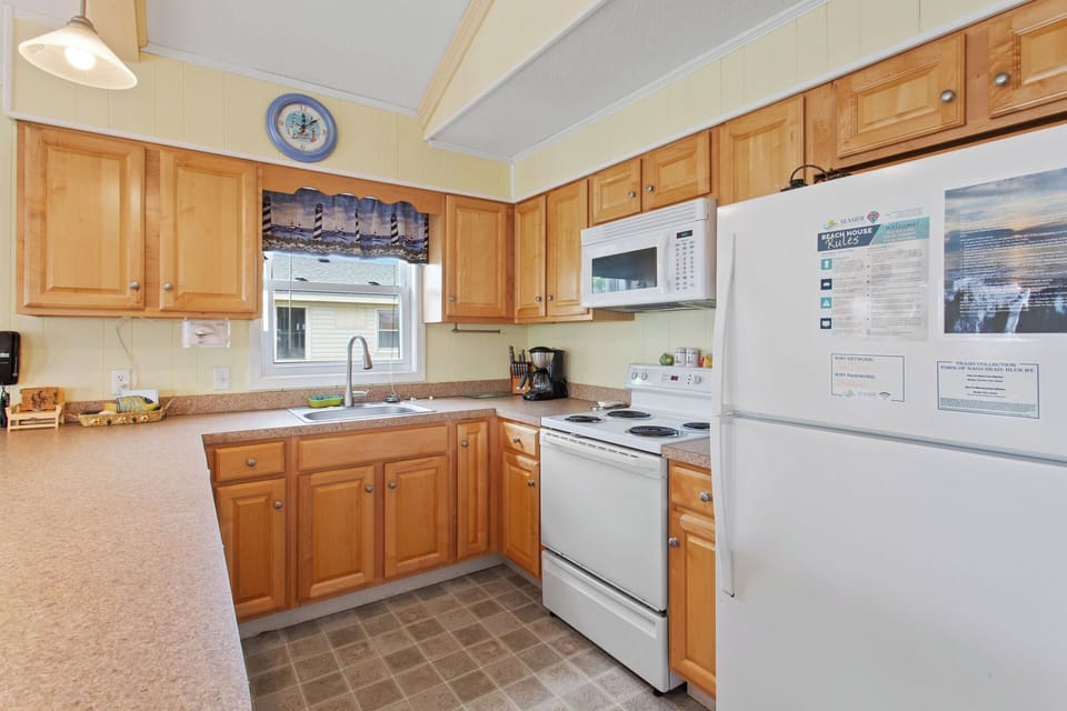 Whip up something delicious in the quaint Kitchen with all modern appliances and everything you need to enjoy a spectacular feast.