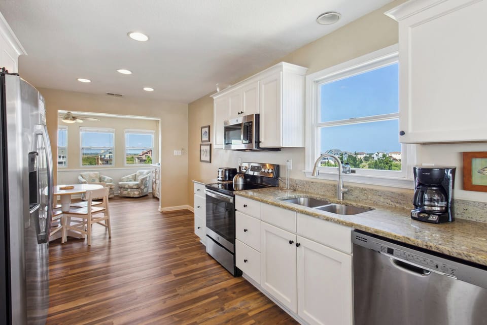 Feel right at home in a large kitchen with plenty of prep space and fully stocked with any appliance you might need including a Keurig coffee maker and free-standing ice maker.