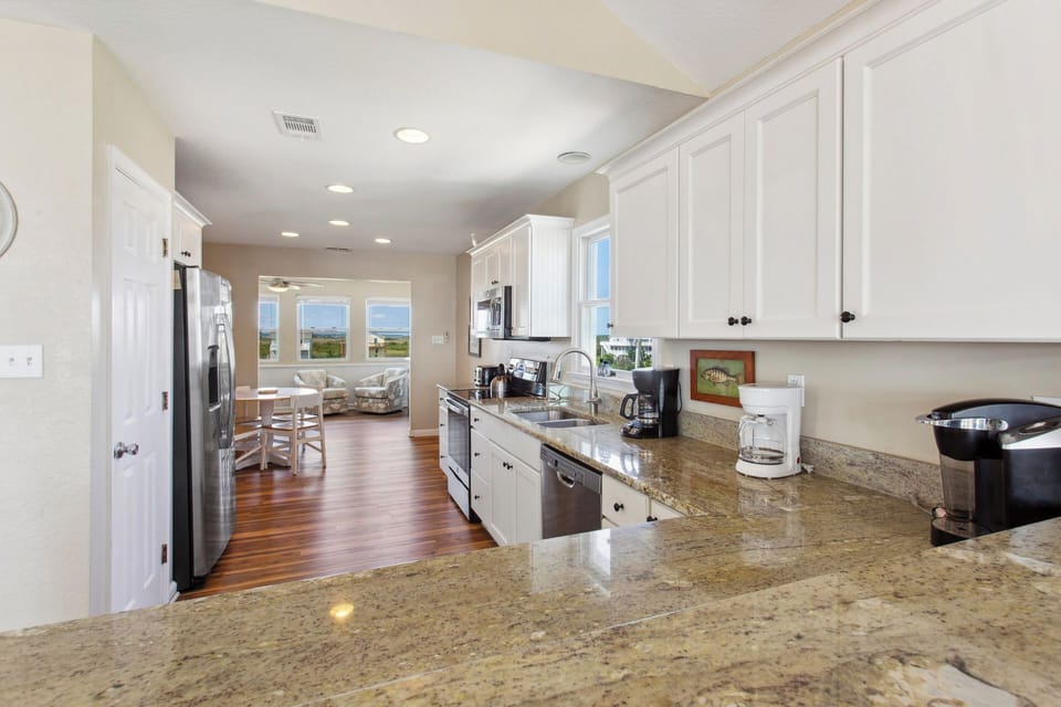 Feel right at home in a large kitchen with plenty of prep space and fully stocked with any appliance you might need including a Keurig coffee maker and free-standing ice maker.