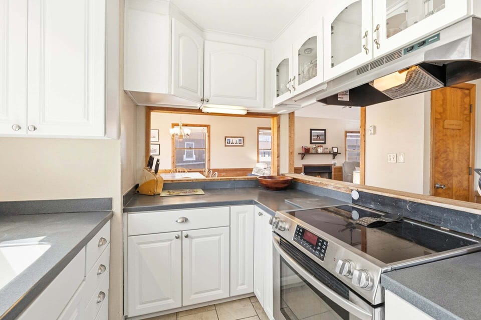 Impress the family with your cooking skills in the Kitchen with a coffee pot and modern appliances.