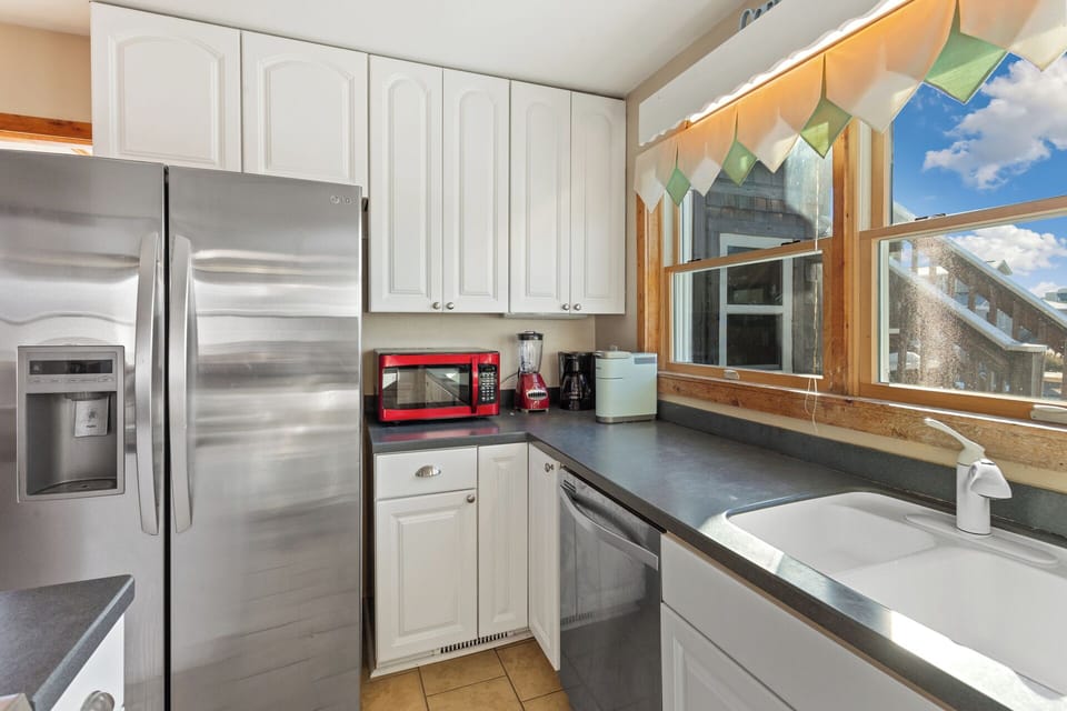Impress the family with your cooking skills in the Kitchen with a coffee pot and modern appliances.