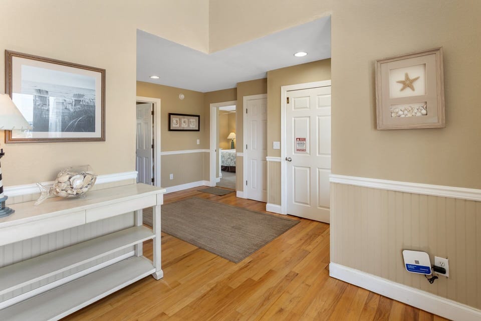The mid-level foyer provides elevator access to all floors and easy navigation throughout the home.