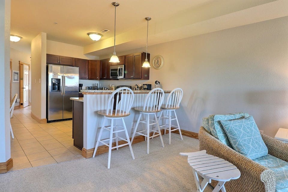 The Kitchen's location is convenient with a breakfast bar that's ideal for snacks and additional dining space.