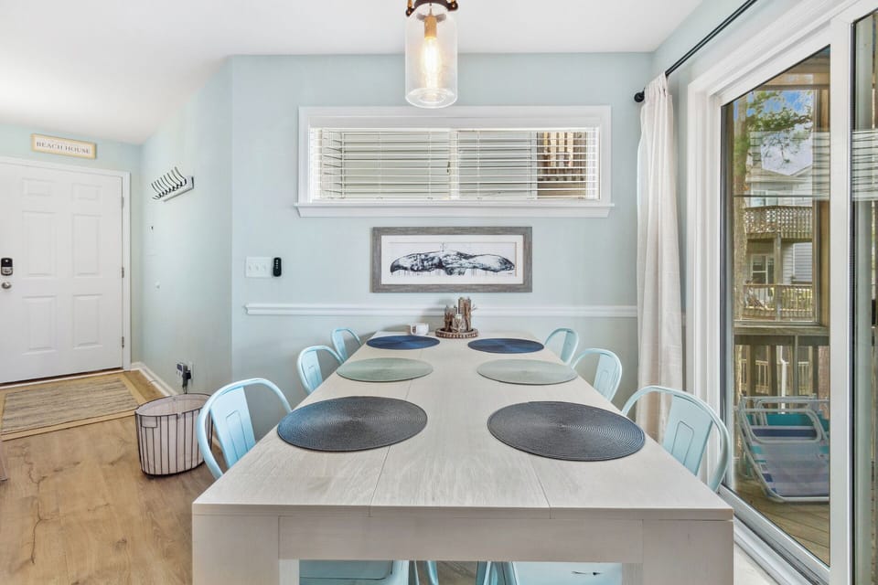 Enjoy a meal together as a family in the Dining Area with tasteful decor and access to the Screened-In Porch!