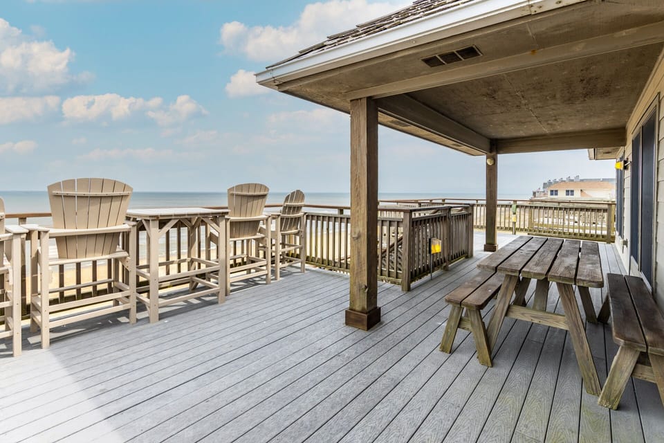 Oceanfront deck with ample seating for lounging and relaxing.