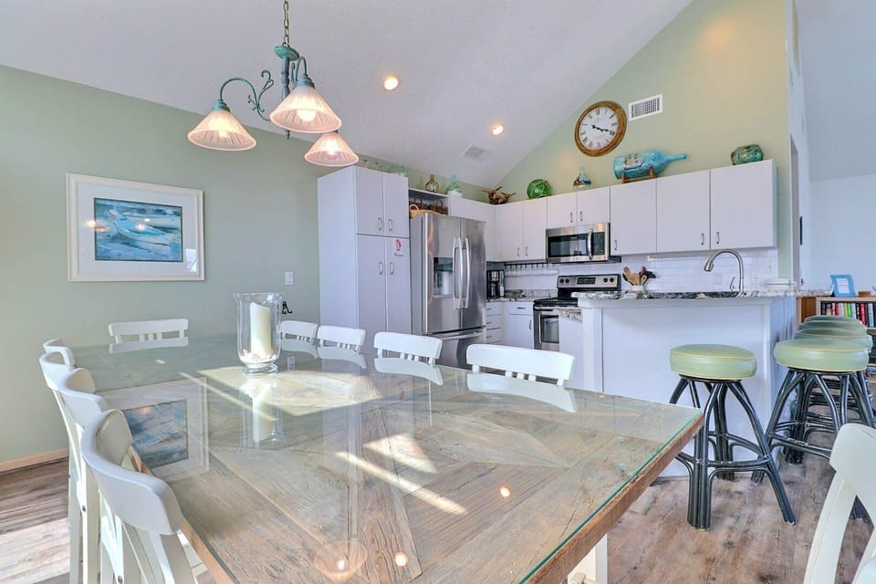The spacious dining area offers seating for 10, making it ideal for family meals and gatherings.
