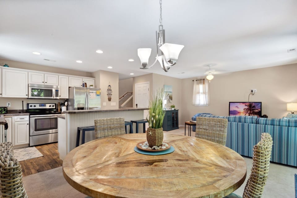 The kitchen island has seating for 3 and the adjoining dining area features additional space for 4.