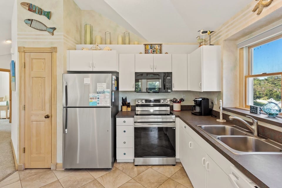 Whip up something delicious in the modern Kitchen with additional counter seating.