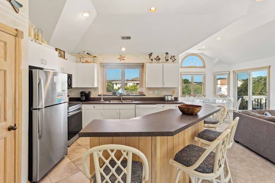 Whip up something delicious in the modern Kitchen with additional counter seating.