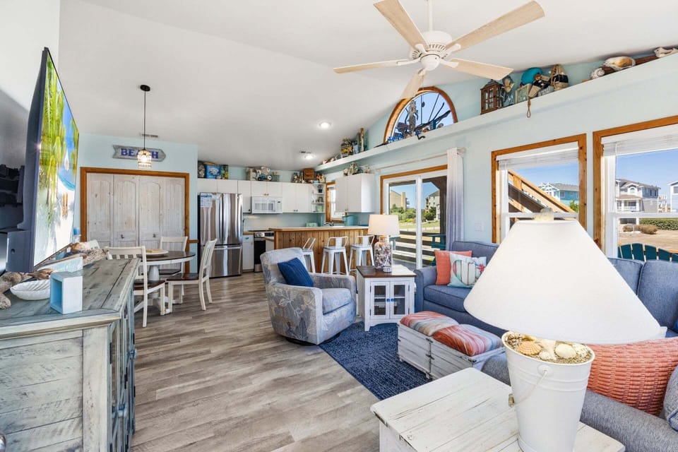 Relax in the spacious Living Area with lots of sunlight and comfortable seating.