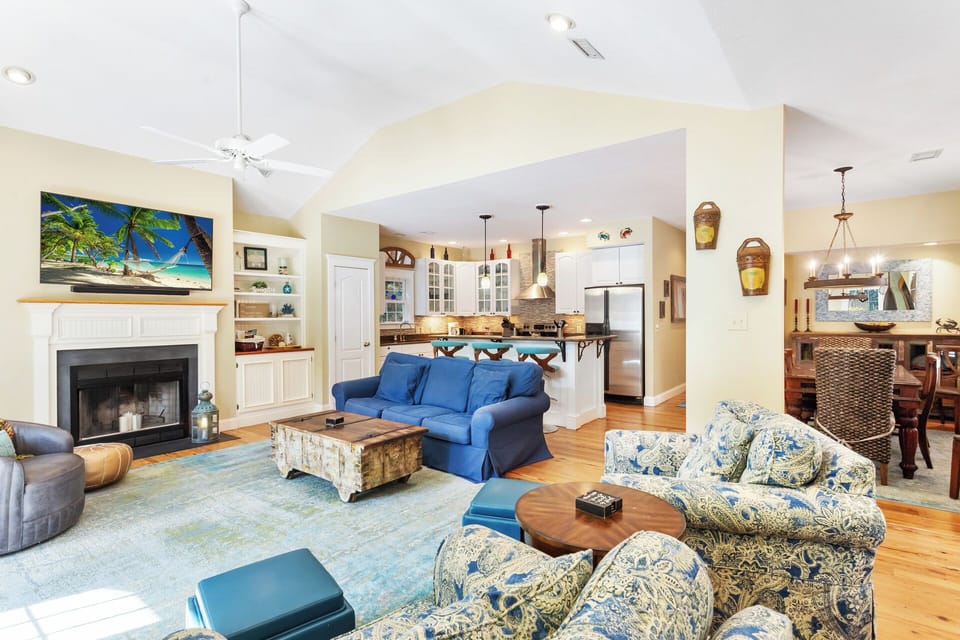 Enjoy the spacious Living Area with a variety of comfortable seating, a fireplace, and a flat-screen TV!
