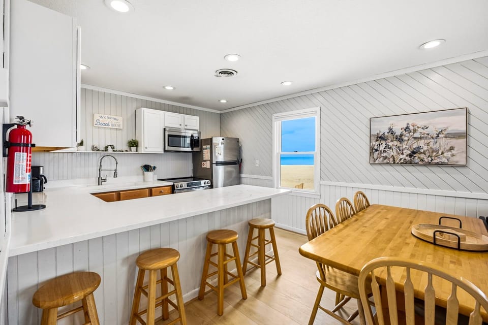Kitchen: Cook with ease in the fully equipped kitchen featuring modern appliances and a dishwasher.