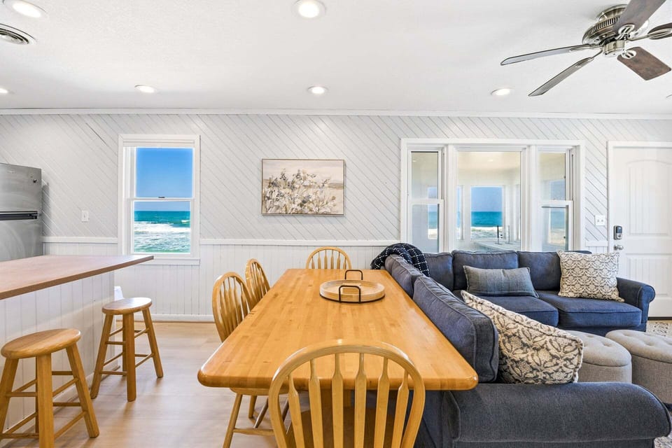 Dining Area: Share meals and ocean views around the dining table with seating for six.