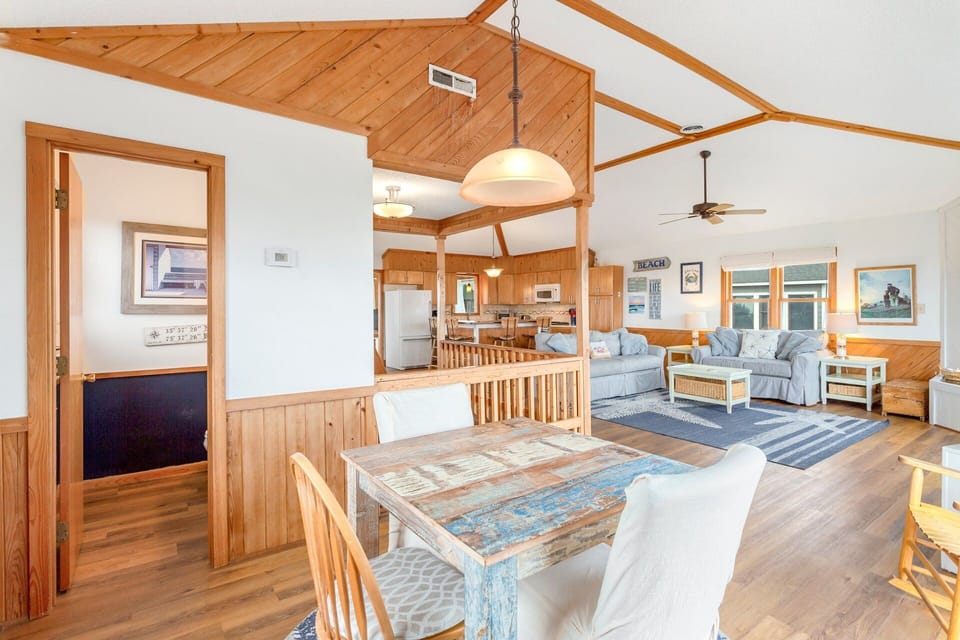 Top-Level Living Area: Bright and open with plenty of seating and sliding doors to sun decks.