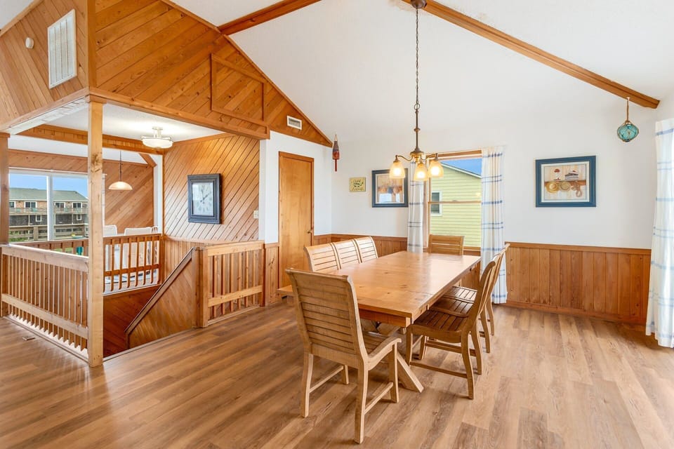 Dining Area: Gather around the large dining table with seating for 8—ideal for family meals.
