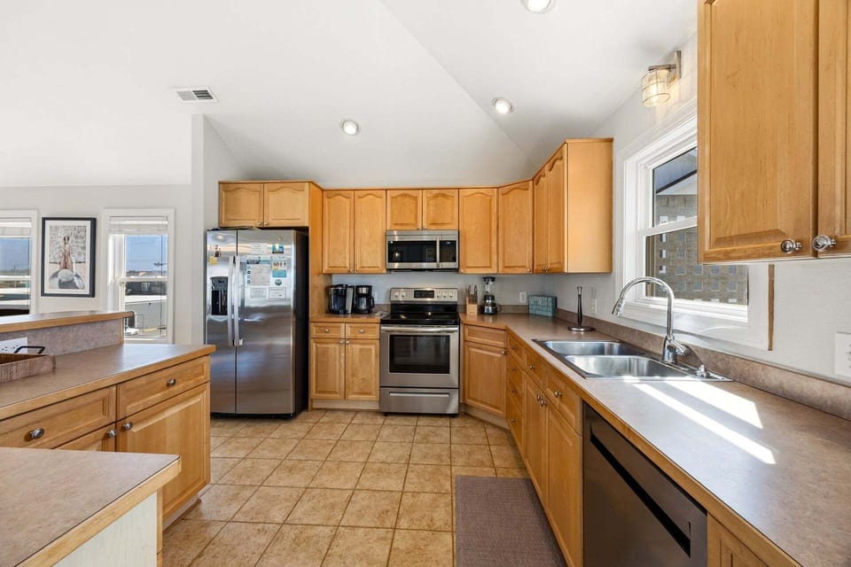 The fully equipped kitchen offers everything needed to prepare fresh seafood and family meals.
