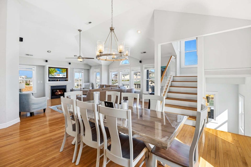 The spacious dining table comfortably seats eight guests for shared meals.