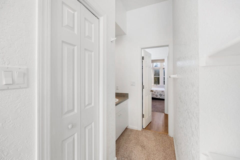The shared hallway bathroom on the ground level features dual sinks, making mornings easier for multiple guests.