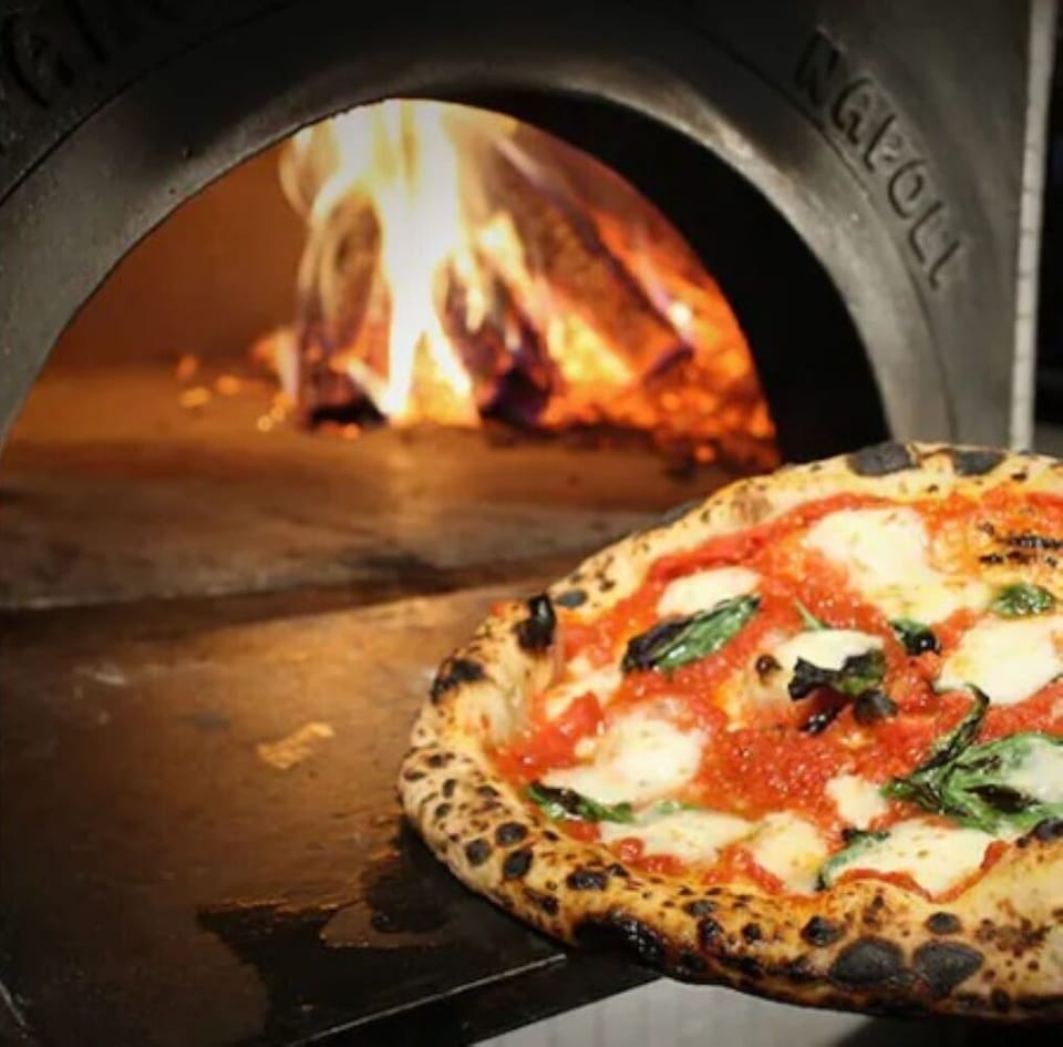 Enjoy a wood-fired pizza