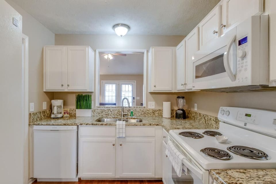 Full kitchen available to cook up your favorite meal with a large window overlooking the living room area.