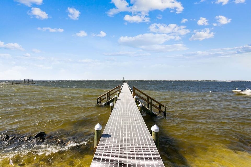 Stroll along the water's edge on our inviting boardwalk. Experience the beauty of nature and the calming embrace of the waterfront. 🚶‍♀️🌊 #BoardwalkBliss #WaterfrontWanderlust #SerenityOnTheShore