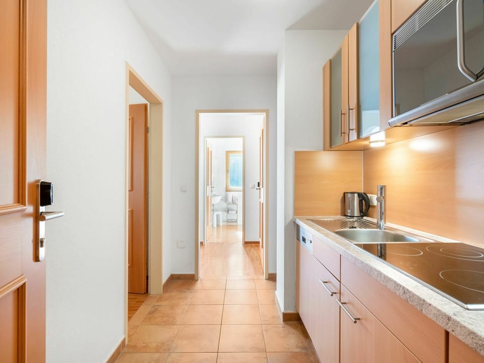 Cabinetry, Countertop, Building, Property, Furniture, Sink, Tap, Wood, Door, Drawer
