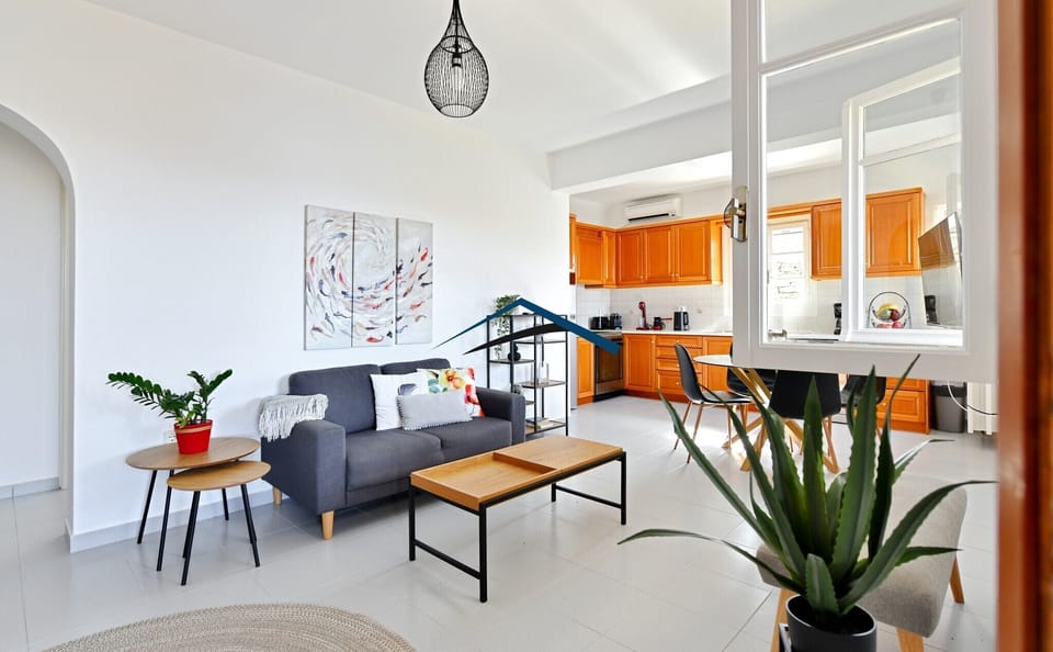 The living room, dining area and kitchen