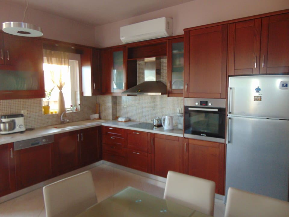 Comfort House, 1 Bedroom, Balcony, Beachfront | Private kitchen | Full-size fridge, oven, dishwasher, coffee/tea maker