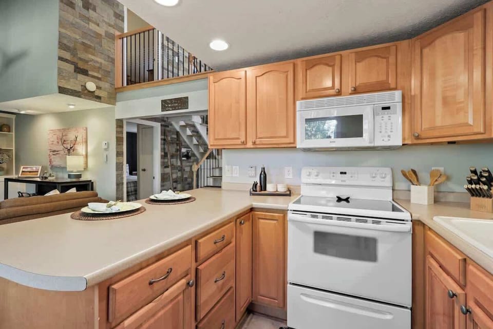 A well-stocked, neatly arranged kitchen designed for sophisticated culinary creations.