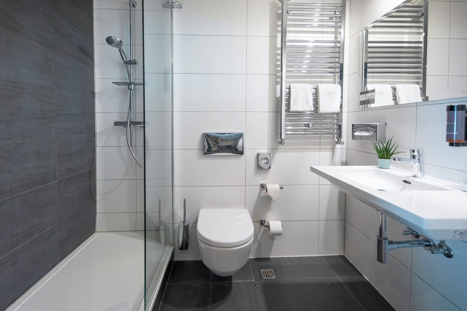 Combined shower/tub, deep soaking tub, hair dryer, bathrobes