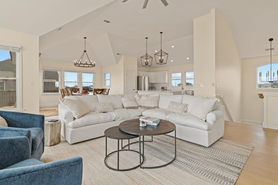 * New light-gray couches to brighten the living space
