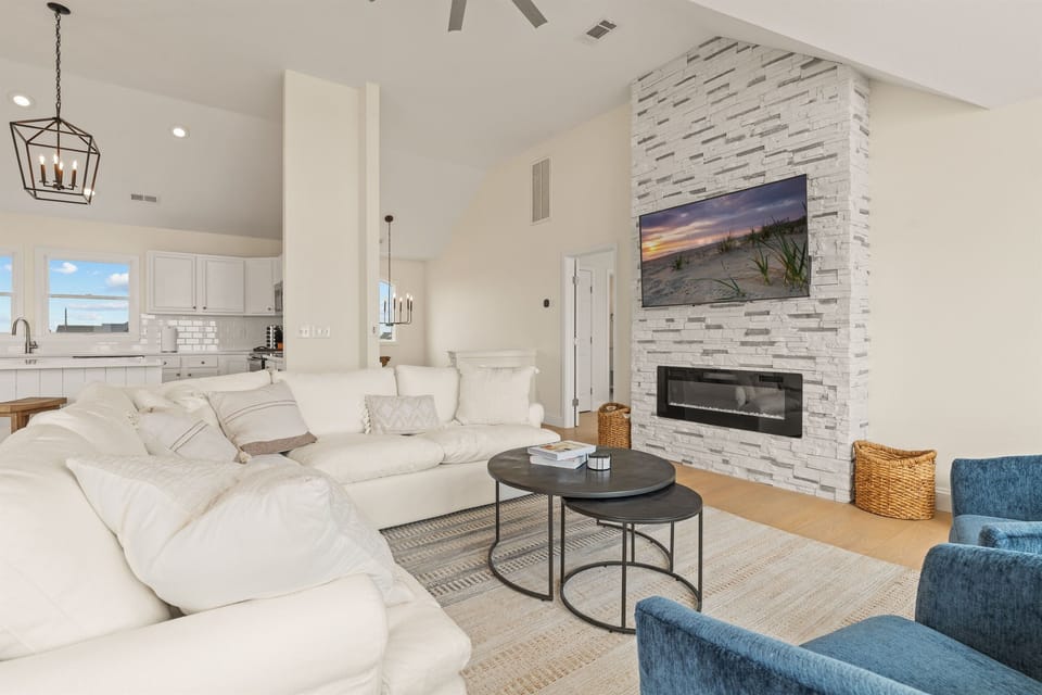 *New light-gray couches are now in for a fresh, airy look.