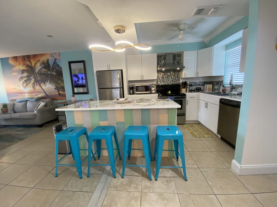 Kitchen offers extras such as blender, crock pot, mixer, wine glasses, toaster.