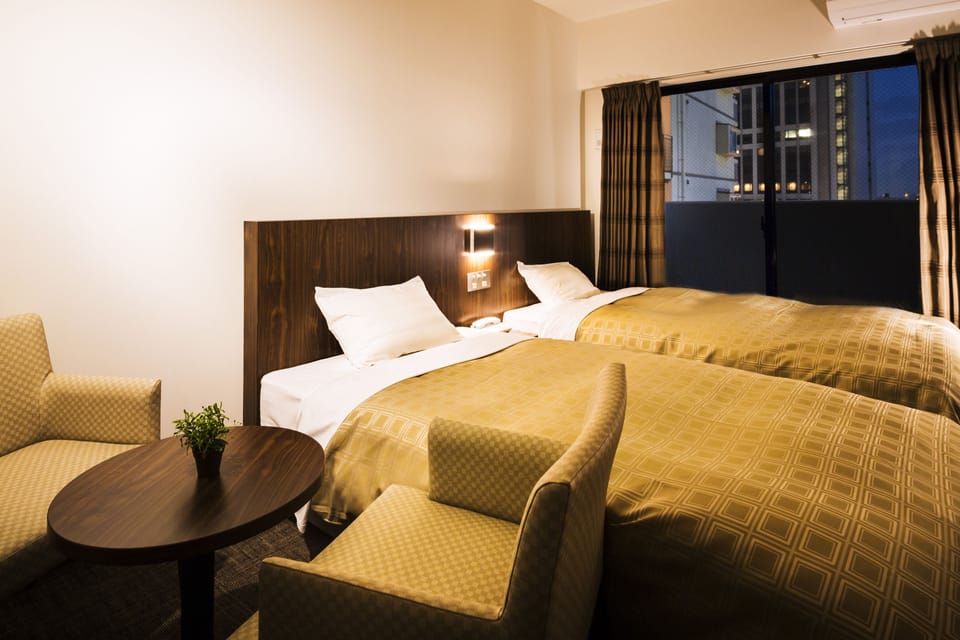 Twin Room, Non Smoking | Blackout drapes, iron/ironing board (on request), WiFi (free)